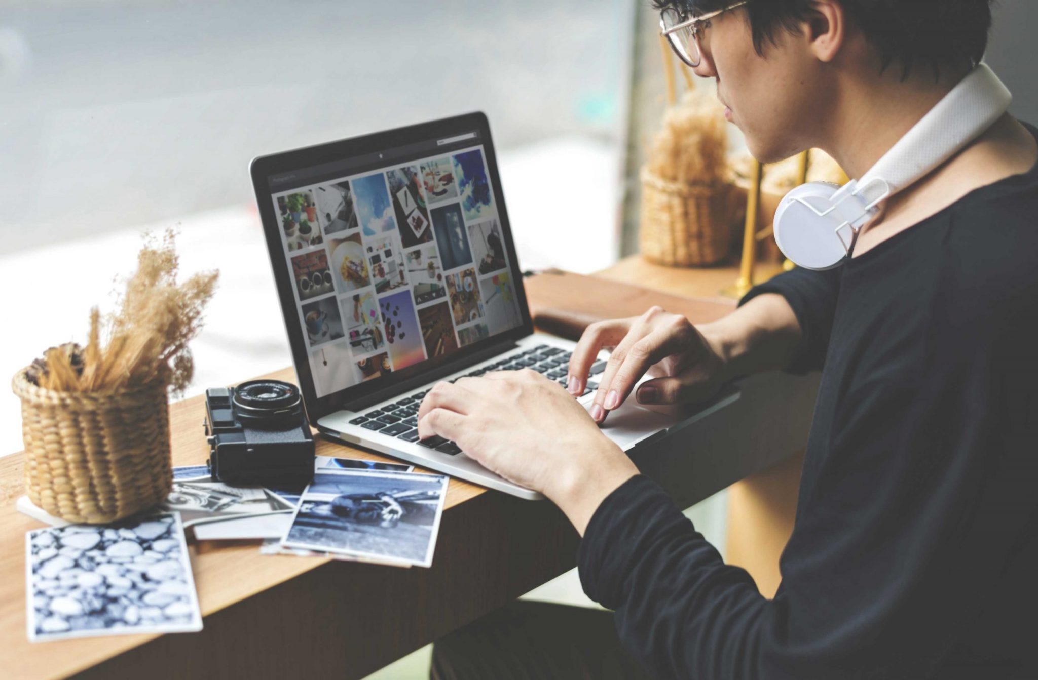 A person editing photos for Search Engine Optimization